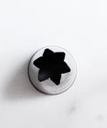 1M pastry tip view from overhead showing the open star design with 6 points.