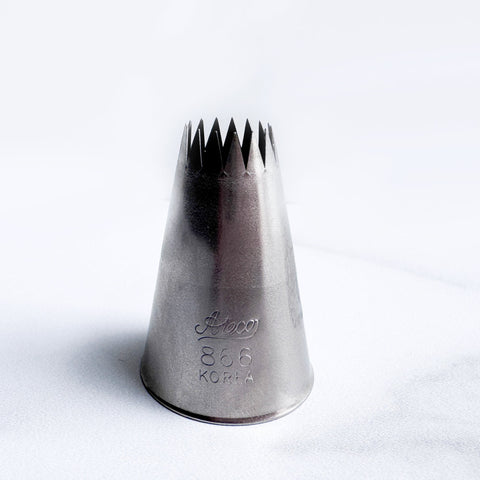 Metal 6B piping tip also known as Ateco 866 sitting on a white background.