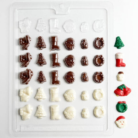 Bite size Christmas assortment chocolate mold with various Christmas-themed shapes on a white background.
