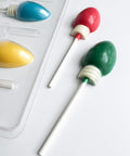 Christmas light pop candy mold close up of the lollipops.