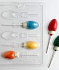 Christmas light pop candy mold along side  christmas light shaped lollipops.