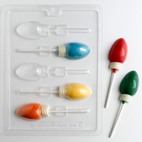 Christmas light pop candy mold along side  christmas light shaped lollipops.