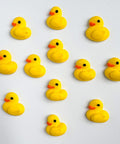 Mini yellow chicks royal icing decorations for decorating cookies and cupcakes.