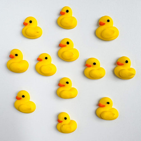 Mini yellow chicks royal icing decorations for decorating cookies and cupcakes.