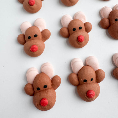 Edible royal icing reindeer decorations for decorating cookies, cakes, cupcakes, and more.