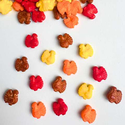 turkey shaped sprinkles in yellow, orange, brown, and red for decorating cakes and cupcakes