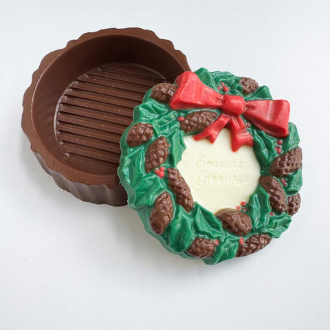 Wreath shaped box made out of chocolate.