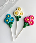 bunch of daisies lollipops with plastic daisy chocolate mold
