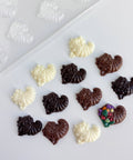little chocolate cornucopias made with bite size cornucopia plastic candy mold shown in the top left hand corner.