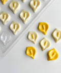 calla lily plastic candy mold along side the chocolates made with the mold