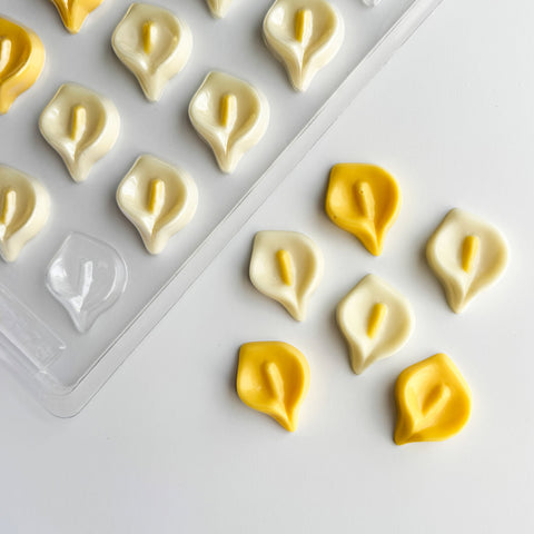 calla lily plastic candy mold along side the chocolates made with the mold