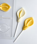 calla lily flower shaped chocolate lollipops along side plastic candy mold