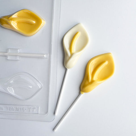 calla lily flower shaped chocolate lollipops along side plastic candy mold