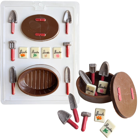 Garden tools and basket set candy mold that makes little shovels, a basket, and seed packets from chocolate