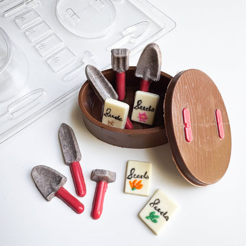 chocolate gardening set with little shovels, seed packets, and a basket made from chocolate and a mold