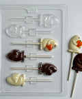 plastic chocolate mold that makes lollipops with ghosts holding pumpkins