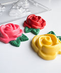 large rose chocolate pieces with plastic candy mold in the background
