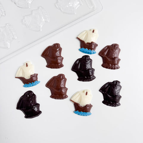 mayflower shaped chocolates and the clear plastic mold to make them