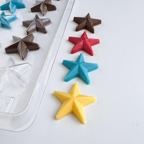 star shaped chocolate mold with chocolate stars next to it