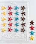 Star-shaped chocolate mold with colorful chocolate stars next to plastic candy mold