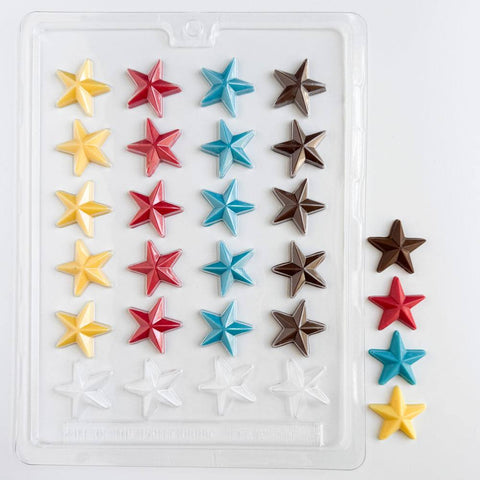 Star-shaped chocolate mold with colorful chocolate stars next to plastic candy mold