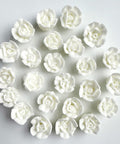 Mini white royal icing roses