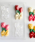 rose corsage candy mold. rose shaped mold with bow to make a chocolate rose corsage