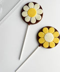 round flower lollipop with plastic chocolate mold in the background