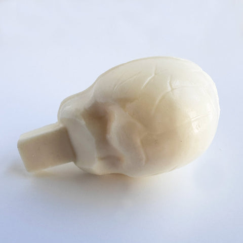 the back side of a white chocolate skull molded using a chocolate mold.