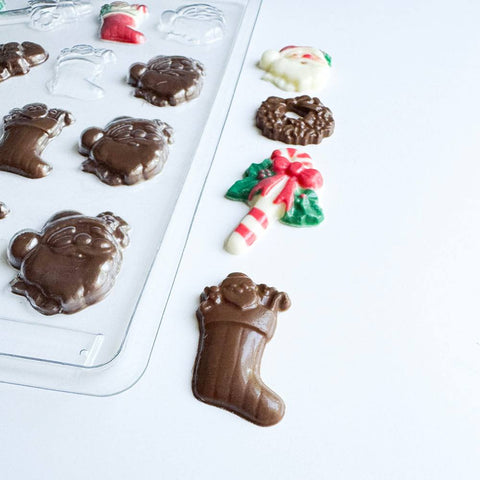 Small Christmas assortment candy mold makes an assortment of thin chocolate pieces in Christmas shapes.