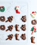 Small Christmas assortment candy mold makes chocolate pieces in the shape of Santa faces, candy canes, wreaths, and stockings.
