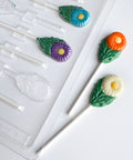 daisy lollipops with green leaves and plastic mold to make them