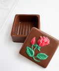 small chocolate box with rose imprinted on cover