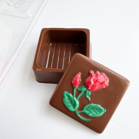 small chocolate box with rose imprinted on cover