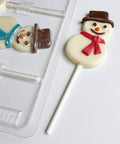 smiling snowman lollipop chocolate mold with snowman shaped lollipops.