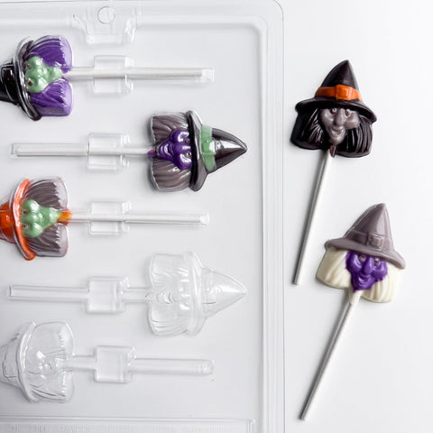 finished witch head lollipops shown along side the plastic chocolate mold used to make them