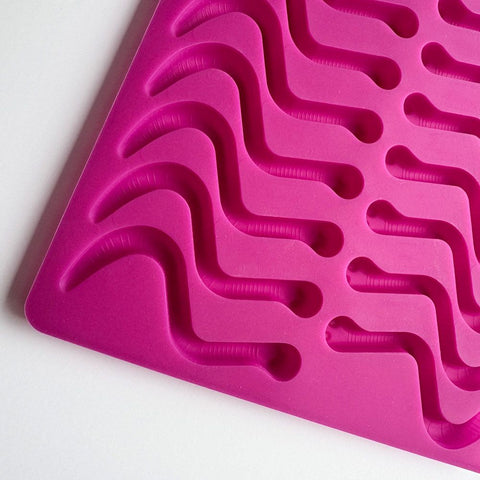 Worm silicone mold cavities for molding chocolate, gummies, hard candy and more.