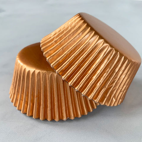 https://confectioneryhouse.com/cdn/shop/products/rose-gold-cupcake-liners-pic_1.jpg?v=1684426833&width=480